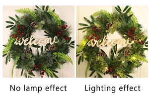 Detail of Christmas pine needle wreath showing unlit and LED lit Welcome sign options