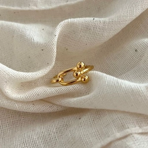 Minimalist 925 sterling silver mini bead ring with a polished U-shaped link design