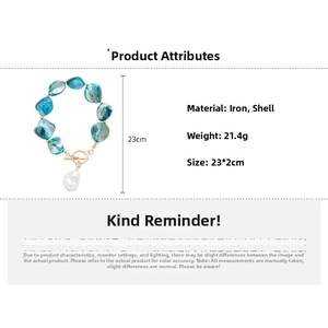 Detailed view of the seashell bracelet with OT clasp showing 21.4g weight and 23x2cm size