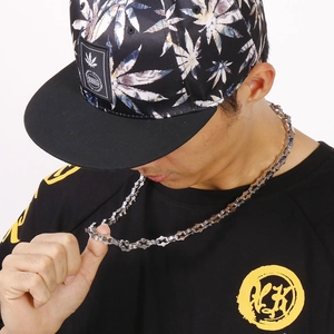 Close-up of men's silver geometric link chain necklace in urban hip hop style
