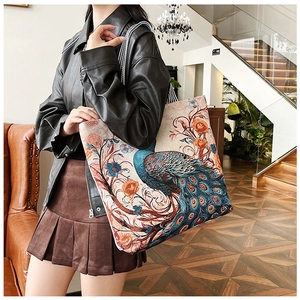 Close-up of ethnic style 3D embroidered butterfly canvas tote bag in natural light