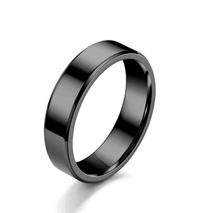 Polished black titanium steel ring with double beveled edges on a white background