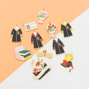 Enamel DIY charms featuring graduation and Mother's Day themes on dual-tone background