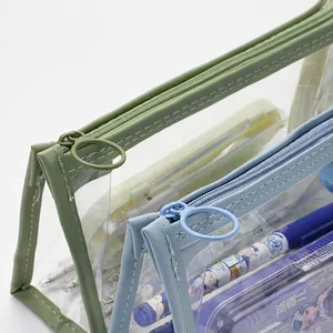 Transparent large capacity pencil cases in green and blue with smooth zippers