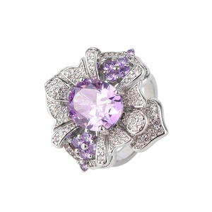 Vintage silver ring with round purple zircon center stone and white pave diamonds