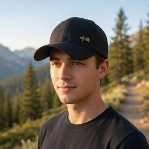 Men's minimalist black baseball cap with gold metal calligraphy detail for outdoors