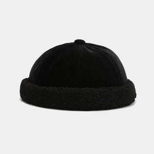 Detail of black velvet crown and sherpa fleece brim on a minimalist winter docker hat