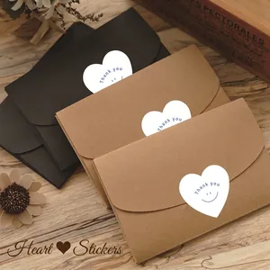 Heart-shaped Thank You stickers on premium black and kraft paper envelopes for gift sealing