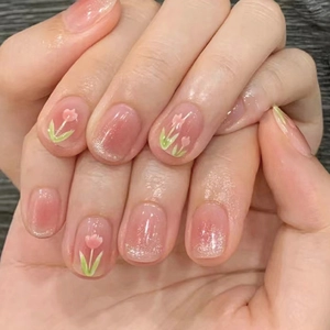 Pink cat-eye gradient press-on nails with hand-painted tulip and silver glitter accents
