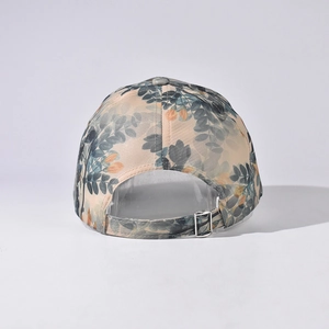Adjustable silver metal buckle on the back of a vintage floral pattern baseball cap
