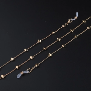 Close-up of golden star eyeglass chain with lobster clasps and silicone loops