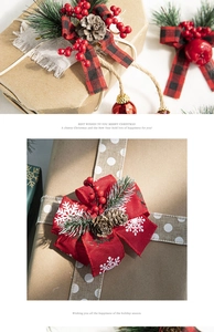 Close-up of Christmas gift box decor with pine cones, red berries and plaid bow