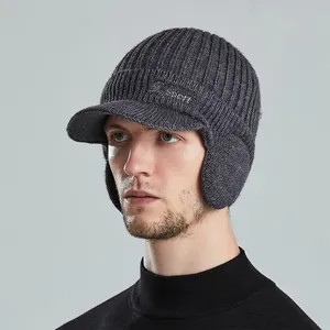 Men's winter knit beanie with ear flaps and visor featuring Sport embroidery in dark grey