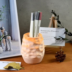 Detail of honeycomb textured silicone mold used as a resin pen holder or small flower vase