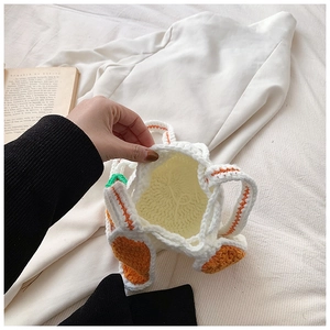 Handmade crochet bunny ear bucket bag with interior view and carrot knit details