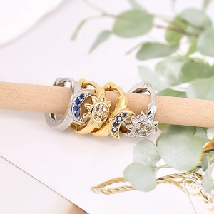 Elegant sun and moon hoop earrings with colorful cubic zirconia in gold and silver finish