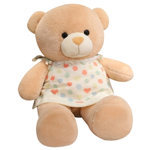 Grande peluche ours en peluche avec robe blanche à motifs de cœur en position assise