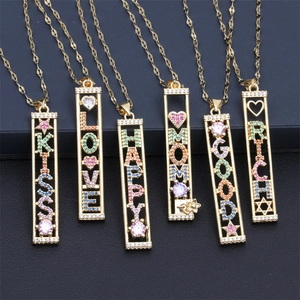 Detailed view of six gold-plated necklaces with colorful zircon inlaid letter pendants