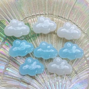 Close-up of sparkling blue and white resin clouds on an iridescent shell glass plate