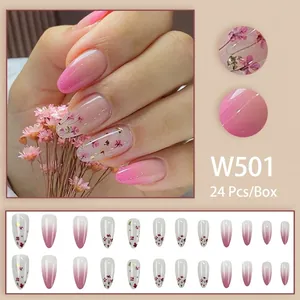 Pink gradient press-on nails with dried flowers and gold foil accents, model W501