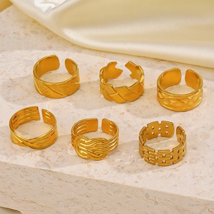 Set of 6 gold plated stainless steel open rings with geometric and braided designs
