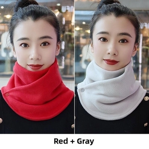 Detail of red and grey fleece neck warmers with side button closure for winter