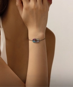 Detail view of S925 sterling silver dark punk bracelet with colorful starburst gemstones