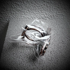Antique bronze geometric ring with colorful labradorite stone shown in clear packaging