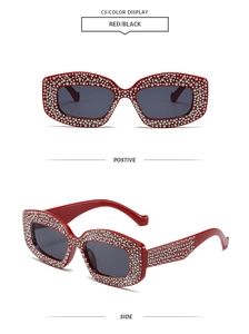 Detail view showing red rhinestone-encrusted frame and side profile of cat-eye sunglasses