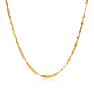 Detailed view of a golden snake chain necklace with a reflective metallic finish