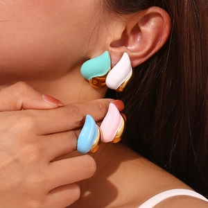 Detailed close-up of a model wearing retro 18K gold plated colorful drip oil heart earrings