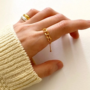 Minimalist 925 sterling silver chain ring set with dangling beads on model hands