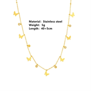 Golden stainless steel necklace featuring butterfly and round zircon pendants on white background
