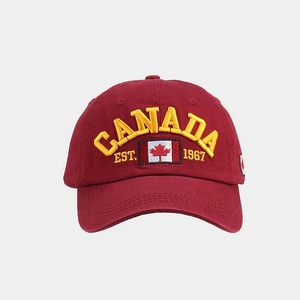 Detail of red cotton baseball cap with yellow Canada 3D embroidery and flag patch