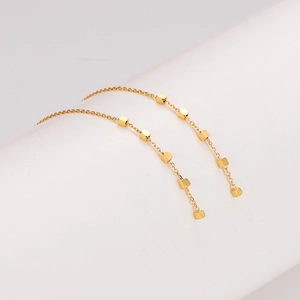 Elegant gold stainless steel tassel chain earrings with geometric cubes on a clean white base