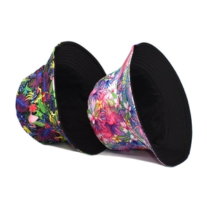 Double-sided sun bucket hat with tropical flamingo print and black solid lining