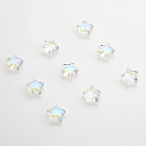 Macro shot of 10mm star-shaped crystal pendants with rainbow luster for DIY jewelry