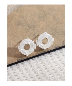Macro view of S925 silver lava texture earrings with white agate inlay detail