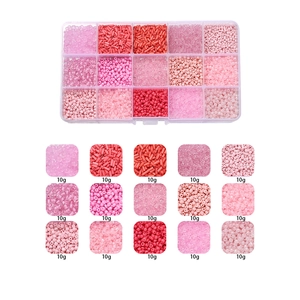 Detail of 15-compartment box with 10g each of pink and red glass seed beads for DIY jewelry
