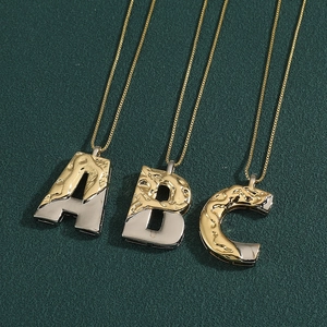 Two-tone alphabet letter A B C necklaces in gold and silver finish with textured design
