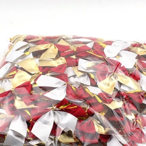 Bulk red, gold, and silver mini Christmas bows in transparent packaging bag
