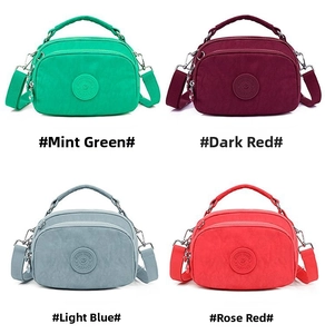 Four colors of nylon crossbody bags featuring a three-layer zipper design and round logo