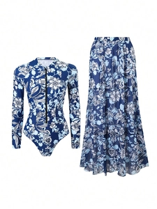 Detail of long sleeve floral swimsuit and matching maxi skirt with front zipper feature