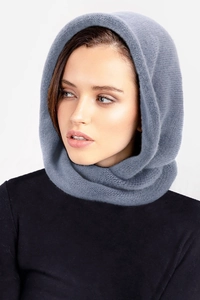 Detail of grey-blue knitted hooded scarf on model showing warm winter wool texture