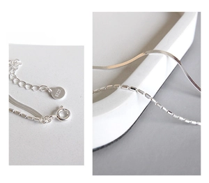 Detailed view of S925 sterling silver double-layered chain with hallmark and lobster clasp