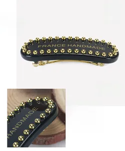 Detail view of acetate hair clip with pearls, measuring 6.9x2.9cm and weighing 17.3g