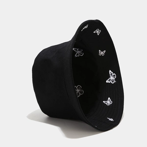 Classic reversible black bucket hat with white butterfly embroidery for sun protection