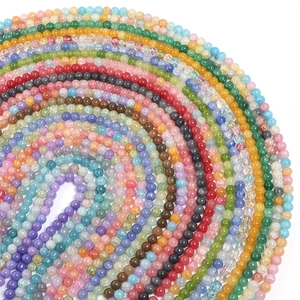 Vibrant multicolored floral glass beads arranged in a spiral for DIY jewelry making