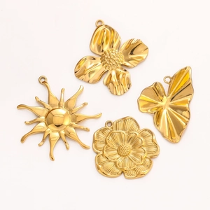 Detailed view of gold stainless steel sun flower and leaf pendants for DIY jewelry