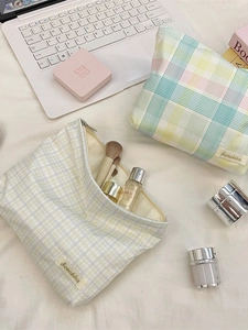 Checkered large capacity travel toiletry bag with zipper and minimalist fabric label